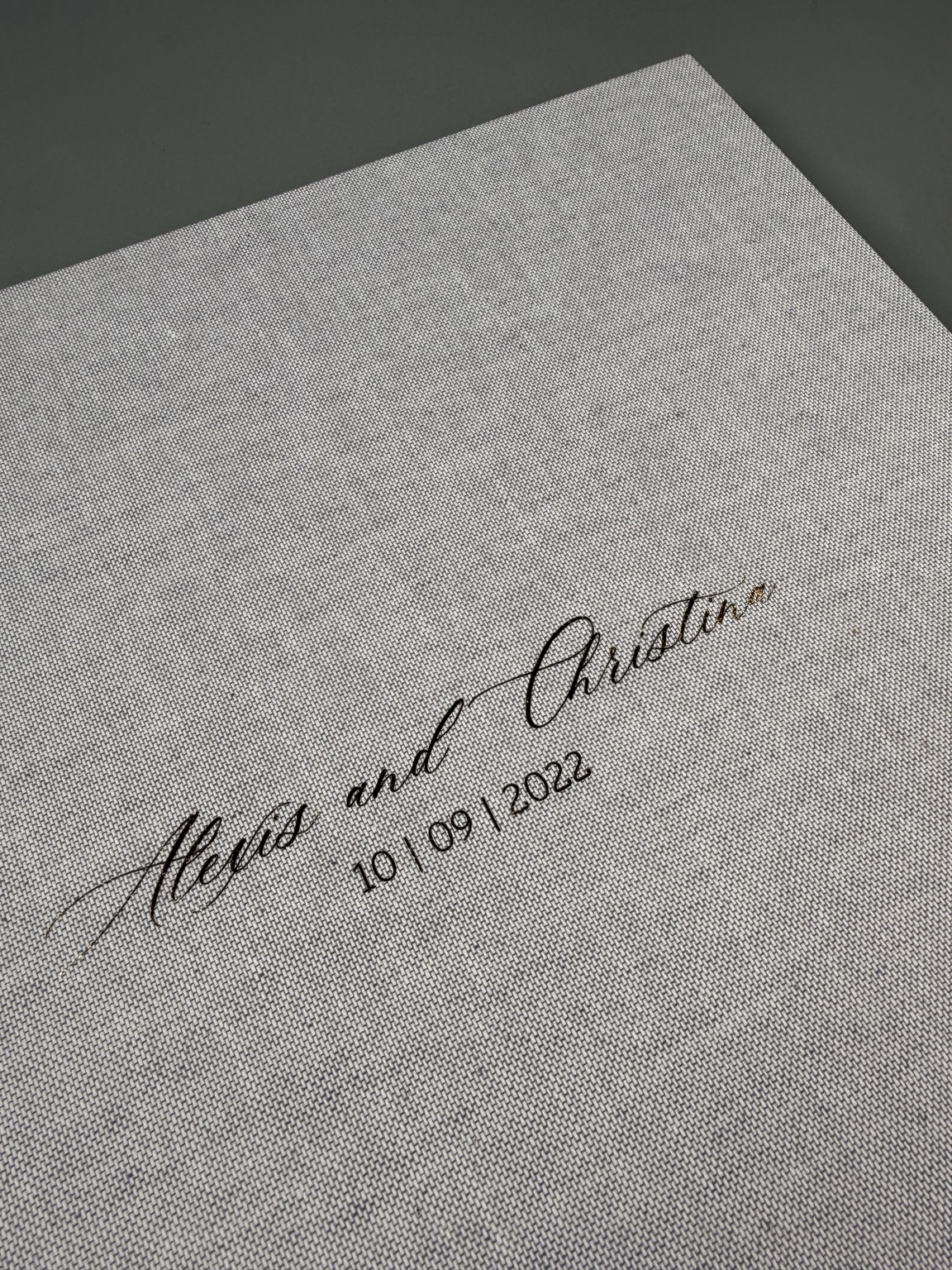 Grey linen album with personalised script lettering